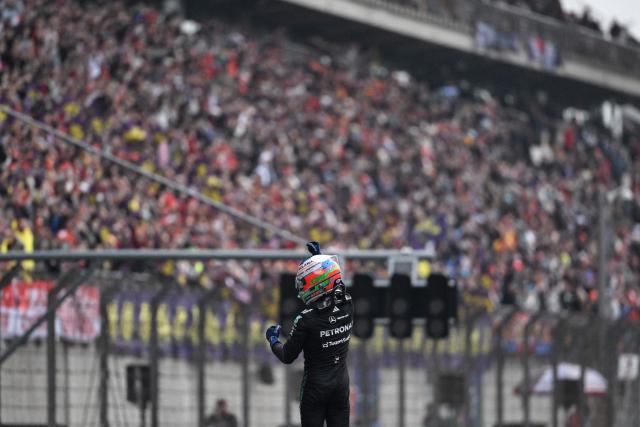 Mercedes' Italian driver Kimi Antonelli celebrates his victory after the Formula One Chinese Grand Prix at the Shanghai International Circuit in Shanghai on March 15, 2026. (Photo by JADE GAO / AFP)