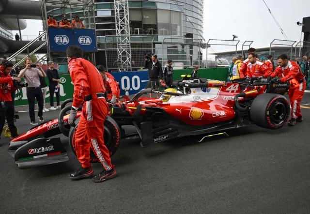 Ferrari's British driver Lewis Hamilton prepares to take the start of the Formula One Chinese Grand Prix at the Shanghai International Circuit in Shanghai on March 15, 2026. (Photo by Jade Gao / AFP)