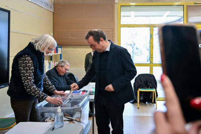 France's Prime Minister Sebastien Lecornu, a candidate on the broad right-wing list "Generations Vernon", casts his ballot during the first round of France's 2026 municipal elections in Vernon, northwestern France, on March 15, 2026. (Photo by Martin LELIEVRE / POOL / AFP)