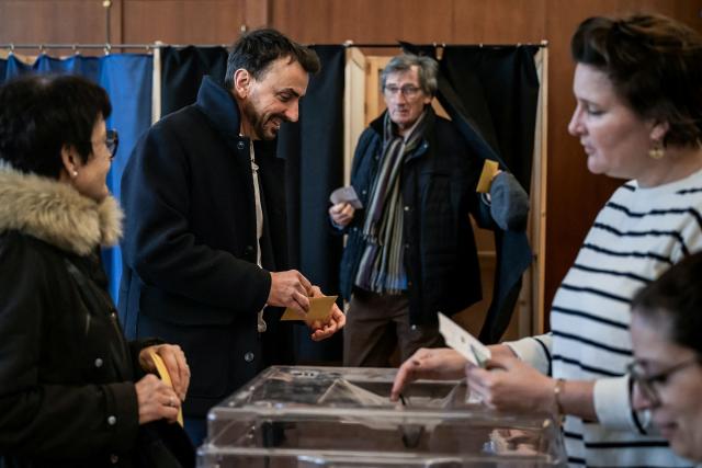Incumbent mayor of Lyon and Europe-Ecology The Greens (EELV) party candidate for re-election Gregory Doucet prepares to cast his ballot during the first round of France's 2026 municipal elections in Lyon, central eastern France, on March 15, 2026. (Photo by ARNAUD FINISTRE / AFP)