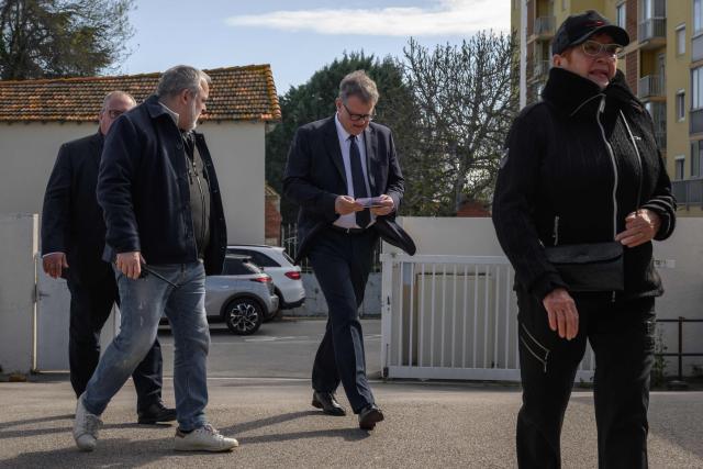 Incumbent mayor of Perpignan and far-right Rassemblement National (RN) party candidate, Louis Aliot (C) arrives to cast his vote during the first round of France's 2026 municipal elections in Perpignan, southwestern France, on March 15, 2026. (Photo by Ed JONES / AFP)