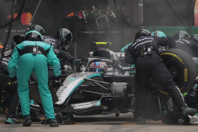 Mechanics work on the car of Mercedes' Italian driver Kimi Antonelli during the Formula One Chinese Grand Prix at the Shanghai International Circuit in Shanghai on March 15, 2026. (Photo by Andy Wong / POOL / AFP)