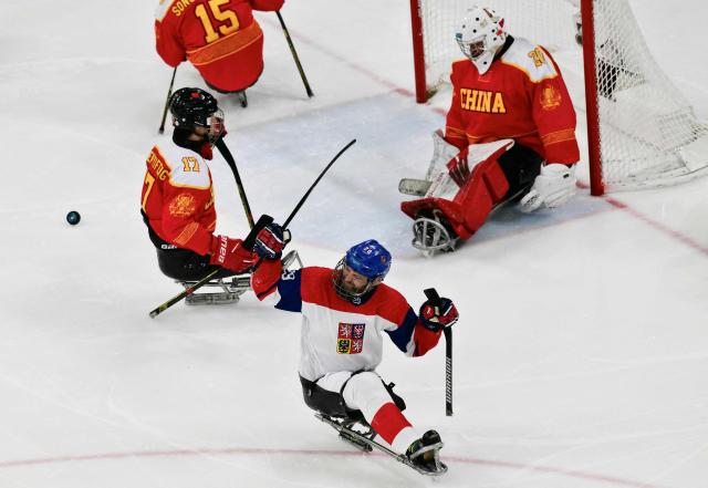 Czech Republic Pavel Kubes celebrates after scoring a goal during the bronze medal ice hockey match between Czech Republic and China at the Milano Cortina 2026 Paralympic Winter Games in Milan on March 15, 2026. (Photo by Stefano RELLANDINI / AFP)
