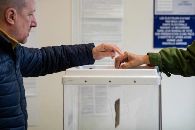 A local resident cast his ballot during the first round of France's 2026 municipal elections in Marseille, southern France, on March 15, 2026. (Photo by Elodie CLEMENT / AFP)