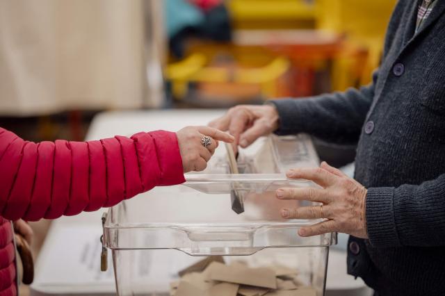 A voter casts a ballot at a polling station during the first round of France's 2026 municipal elections in Menton, southeastern France, on March 15, 2026. (Photo by Frederic DIDES / AFP)