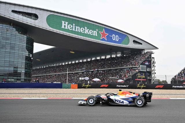Racing Bulls's British driver Arvid Lindblad drives during the Formula One Chinese Grand Prix at the Shanghai International Circuit in Shanghai on March 15, 2026. (Photo by Hector RETAMAL / AFP)