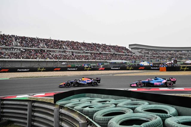 Red Bull Racing's Dutch driver Max Verstappen (L) and Alpine's French driver Pierre Gasly (R) drive during the Formula One Chinese Grand Prix at the Shanghai International Circuit in Shanghai on March 15, 2026. (Photo by Hector RETAMAL / AFP)