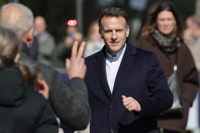 France's President Emmanuel Macron leaves the polling station after voting for the first round of France's 2026 municipal elections in Le Touquet, northern France, on March 15, 2026. (Photo by Ludovic MARIN / AFP)