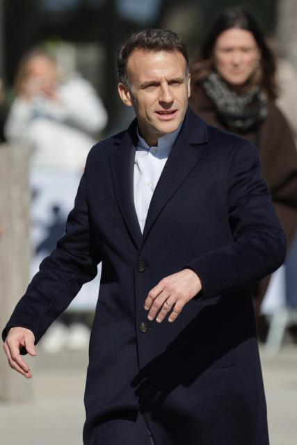 France's President Emmanuel Macron leaves the polling station after voting for the first round of France's 2026 municipal elections in Le Touquet, northern France, on March 15, 2026. (Photo by Ludovic MARIN / AFP)