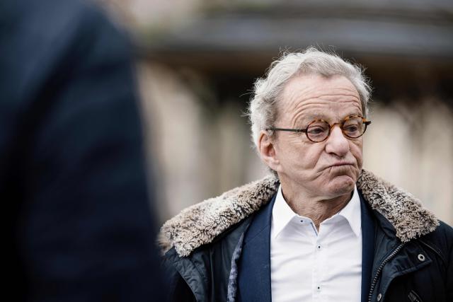 Former Mayor of Grenoble and right-wing Les Republicains (LR) party candidate for his re-election Alain Carignon reacts after leaving casting his ballot outside the polling station during the first round of France's 2026 municipal elections in Grenoble, central France on March 15, 2026. (Photo by Maxime GRUSS / AFP)