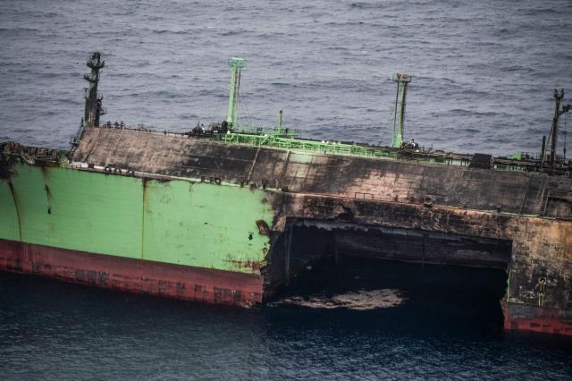 This aerial photo taken on March 15, 2026 shows the wreck of Russian liquified natural gas (LNG) carrier Arctic Metagaz, which is adrift between Malta and Lampedusa. The vessel, which was hit by "sudden explosions followed by a massive fire" according to Libyan port authority, was sanctioned by the United States and the European Union for being one of Russia's so-called "shadow fleet" of ageing tankers that carry its oil and gas around the world, skirting Western restrictions. Russian President Vladimir Putin accused Kyiv of having carried out a "terrorist attack" on the Arctic Metagaz. All 30 crew members were rescued, Moscow said. (Photo by Matthew XUEREB / Newsbook Malta / AFP)