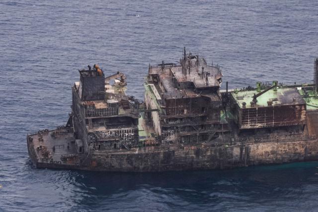 This aerial photo taken on March 15, 2026 shows the wreck of Russian liquified natural gas (LNG) carrier Arctic Metagaz, which is adrift between Malta and Lampedusa. The vessel, which was hit by "sudden explosions followed by a massive fire" according to Libyan port authority, was sanctioned by the United States and the European Union for being one of Russia's so-called "shadow fleet" of ageing tankers that carry its oil and gas around the world, skirting Western restrictions. Russian President Vladimir Putin accused Kyiv of having carried out a "terrorist attack" on the Arctic Metagaz. All 30 crew members were rescued, Moscow said. (Photo by Matthew XUEREB / Newsbook Malta / AFP)