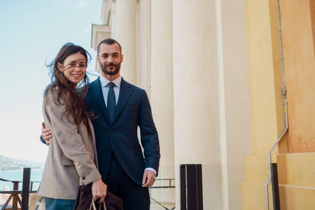 Menton's right-wing coalition "Renouveau Mentonnais" (Menton Revival) mayoral candidate, Louis Sarkozy (R) and his wife Natali Husic (L) poses during the first round of France's 2026 municipal elections in Menton, southeastern France on March 15, 2026. (Photo by Frederic DIDES / AFP)