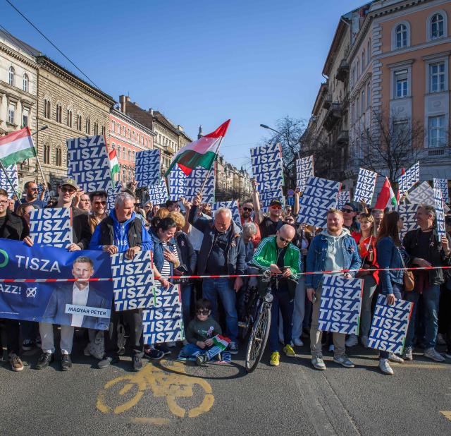 People protest during a "National March” of Hungarian opposition leader and president of the TISZA (Respect and Freedom) party in Budapest, Hungary on March 15, 2026, on the 178th anniversary of the Hungarian Revolution and War of Independence of 1848-1849. The 1848-1849 revolution in the Kingdom of Hungary grew into a war for independence from the Austrian Empire, ruled by the Habsburg dynasty. (Photo by Ferenc ISZA / AFP)