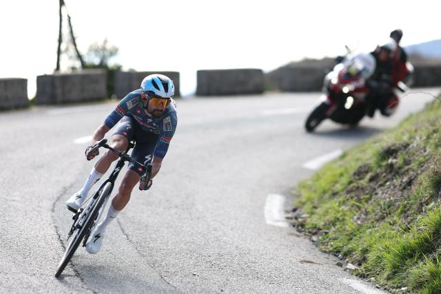 Soudal Quick-Step's French rider Valentin Paret-Peintre cycles downhill in a breakaway during the 8th and final stage of the Paris-Nice cycling race, 129.2 km between Nice and Nice, on March 15, 2026. (Photo by Anne-Christine POUJOULAT / AFP)