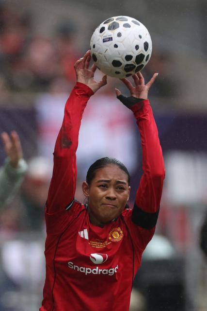 Manchester United's Canadian defender #14 Jayde Riviere takes a throw-in during the English Women's League Cup final football match between Chelsea and Manchester United at Ashton Gate stadium in Bristol, south-west England on March 15, 2026. (Photo by Adrian Dennis / AFP)
