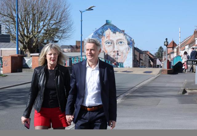 Communist Party (PC) mayoral candidate Fabien Roussel arrives with his wife to vote for the first round of France's 2026 municipal elections in Saint-Amand-les-Eaux, northern France on March 15, 2026. (Photo by Francois LO PRESTI / AFP)