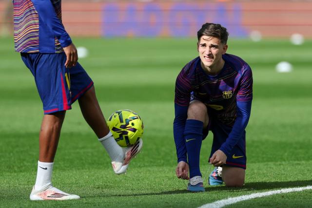 Barcelona's Spanish midfielder #06 Pablo Gavi warms up before the Spanish League football match between FC Barcelona and Sevilla FC at the Camp Nou Stadium in Barcelona, on March 15, 2026. (Photo by Lluis GENE / AFP)