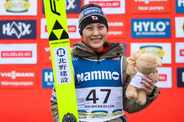 Second placed Japan's Nozomi Maruyama poses on the podium after the Women Individual Large Hill at the FIS Jumping World Cup in Holmenkollen, Oslo, Norway on March 15, 2026. (Photo by Christoffer Andersen / NTB / AFP) / Norway OUT