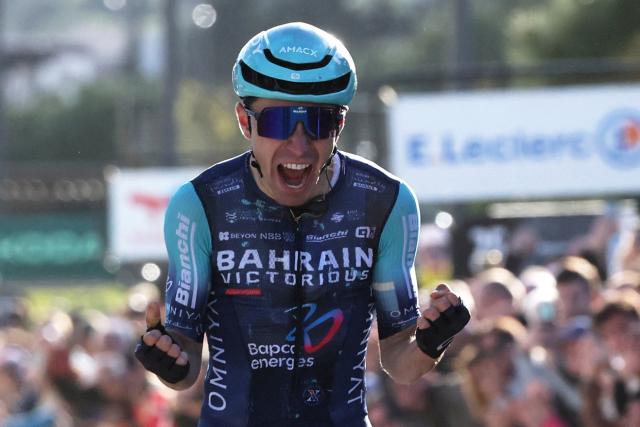Bahrain - Victorious' French rider Lenny Martinez celebrates as he crosses the finish to win the 8th and final stage of the Paris-Nice cycling race, 129.2 km between Nice and Nice, on March 15, 2026. (Photo by Anne-Christine POUJOULAT / AFP)