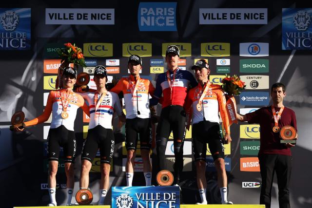 INEOS Grenadiers' riders celebrates on the podium after winning the team ranking at the end of the 2026 Paris-Nice cycling race, on March 15, 2026. (Photo by Anne-Christine POUJOULAT / AFP)