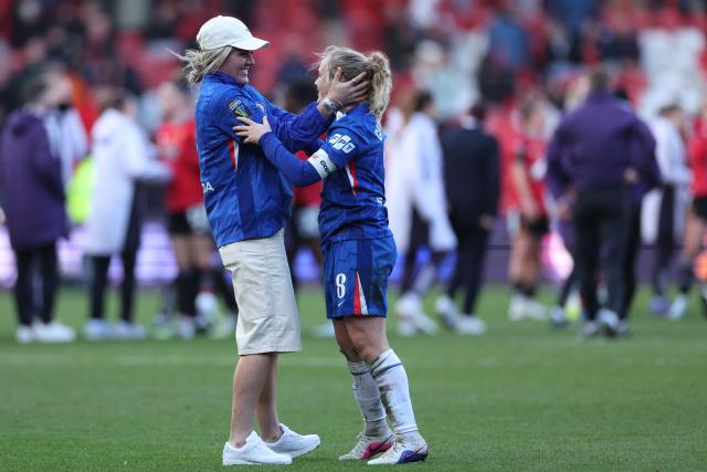 Chelsea's English defender #04 Millie Bright (L) runs on to celebrate with Chelsea's Scottish midfielder #08 Erin Cuthbert (R) after the English Women's League Cup final football match between Chelsea and Manchester United at Ashton Gate stadium in Bristol, south-west England on March 15, 2026. Chelsea won the game 2-0. (Photo by Adrian Dennis / AFP)