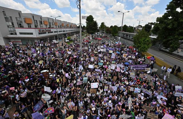 Hundreds of women gather before the start of a march to commemorate the Internatiomal Women's Day in Bogota on March 15, 2026. (Photo by Diana SANCHEZ / AFP)