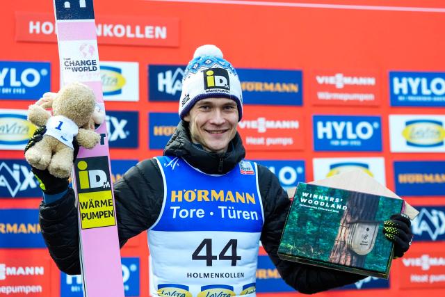 Third placed Finland's Antti Aalto celebrates on the podium after the men's Individual Large Hill at the FIS Jumping World Cup in Holmenkollen, Oslo, Norway on March 15, 2026. (Photo by Terje Pedersen / NTB / AFP) / Norway OUT