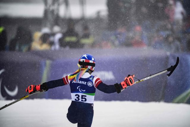 US Patrick Halgren celebrates as he crosses the finish line of the men ski slalom during the Milano Cortina 2026 Paralympic Winter Games on March 15, 2026 in Cortina d’Ampezzo. (Photo by JEFF PACHOUD / AFP)