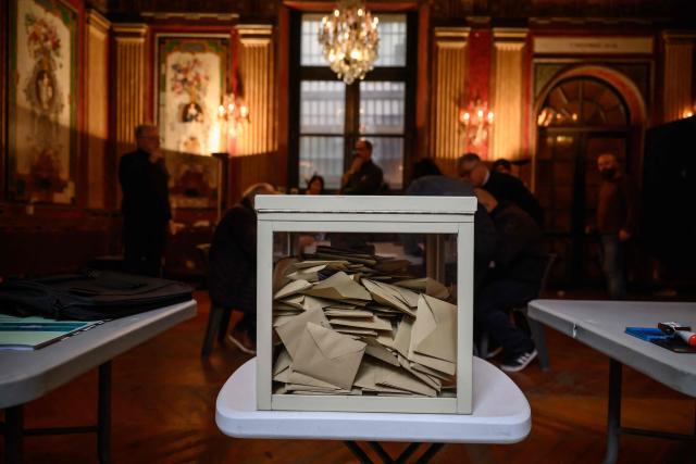 This photograph shows a ballot box following the closing of voting during municipal elections at the city hall in Perpignan, south-western France, on March 15, 2026. (Photo by Ed JONES / AFP)
