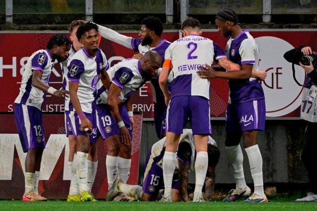 Toulouse’s players celebrate after scoring a goal during the French L1 football match between FC Metz and Toulouse FC at the Stade Saint-Symphorien in Longeville-les-Metz, eastern France, on March 15, 2026. (Photo by Jean-Christophe VERHAEGEN / AFP)