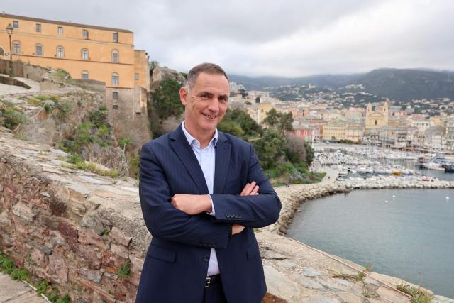 (FILES) President of the executive council of the Corsican Assembly Gilles Simeoni, a candidate for municipal election poses in Bastia, on the French Mediterranean island of Corsica, on February 26, 2026. Simeoni was well ahead of the votes with 35.1%, according to first estimates of the first round of France's 2026 municipal elections in Bastia on March 15, 2026. (Photo by Pascal POCHARD-CASABIANCA / AFP)