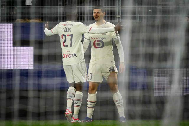 Lille's Belgian forward #07 Matias Fernandez-Pardo (R)celebrates after scoring  during the French L1 football match between Stade Rennais and Losc Lille at the Roazhon Park stadium in Rennes, western France on March 15, 2026. (Photo by Loic VENANCE / AFP)