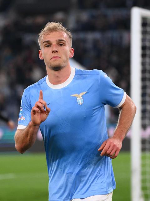 Lazio's Danish forward #18 Gustav Isaksen celebrates after scoring Lazio's first goal during the Italian Serie A football match between Lazio and AC Milan at the Olympic Stadium in Rome on March 15, 2026. (Photo by Alberto PIZZOLI / AFP)