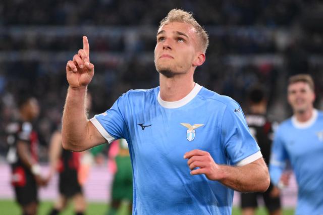 Lazio's Danish forward #18 Gustav Isaksen celebrates after scoring Lazio's first goal during the Italian Serie A football match between Lazio and AC Milan at the Olympic Stadium in Rome on March 15, 2026. (Photo by Alberto PIZZOLI / AFP)