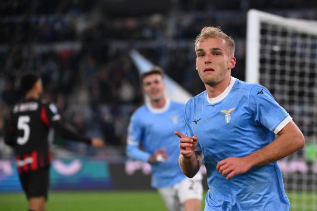 Lazio's Danish forward #18 Gustav Isaksen (R) celebrates after scoring Lazio's first goal during the Italian Serie A football match between Lazio and AC Milan at the Olympic Stadium in Rome on March 15, 2026. (Photo by Alberto PIZZOLI / AFP)