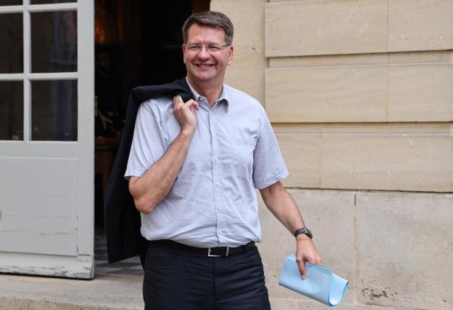 (FILES) France's outgoing Deputy Minister for Transports Patrice Vergriete leaves after a meeting with ministers for a progress report on the Paris 2024 Olympic Games at the Hotel Matignon in Paris on July 31, 2024. The former minister of Emmanuel Macron and Mayor of Dunkirk (Nord) was overwhelmingly re-elected on March 15, 2026 in the first round with 64.47% of the votes he announced on French TV network France 3. (Photo by Ludovic MARIN / AFP)