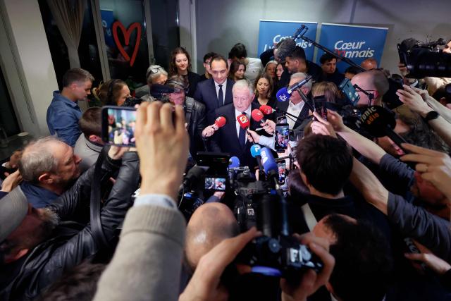 Lyon's mayoral candidate, whose list is supported by right-wing Les Republicains (LR) party and centrist party Renaissance, Jean-Michel Aulas addresses journalists following the results of the first round of France's 2026 municipal elections in Lyon, central eastern France, on March 15, 2026. (Photo by Alex MARTIN / AFP)