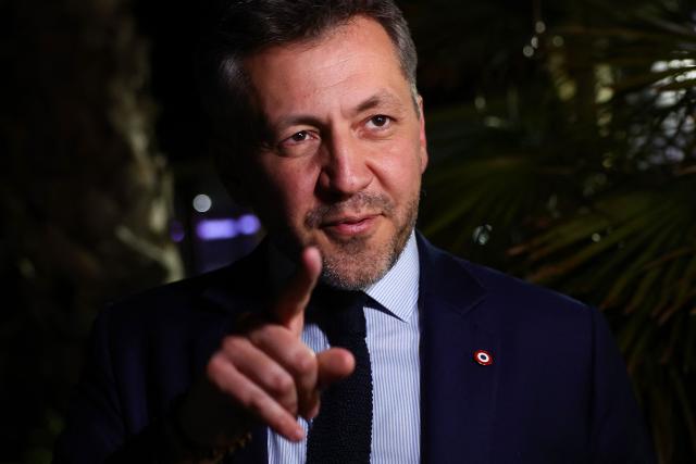 Marseille's far-right Rassemblement National (RN) party member of Parliament and mayoral candidate Franck Allisio leaves after delivering a speech following the results of the first round of France's 2026 municipal elections in Marseille, southern France, on March 15, 2026. (Photo by CLEMENT MAHOUDEAU / AFP)