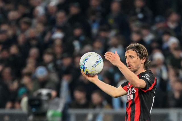 AC Milan's Croatian midfielder #14 Luka Modric prepares to take a throw in during the Italian Serie A football match between Lazio and AC Milan at the Olympic Stadium in Rome on March 15, 2026. (Photo by Alberto PIZZOLI / AFP)