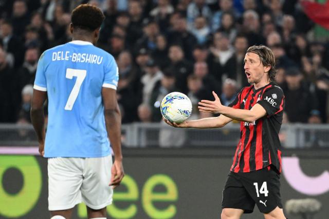 AC Milan's Croatian midfielder #14 Luka Modric (R) reacts during the Italian Serie A football match between Lazio and AC Milan at the Olympic Stadium in Rome on March 15, 2026. (Photo by Alberto PIZZOLI / AFP)