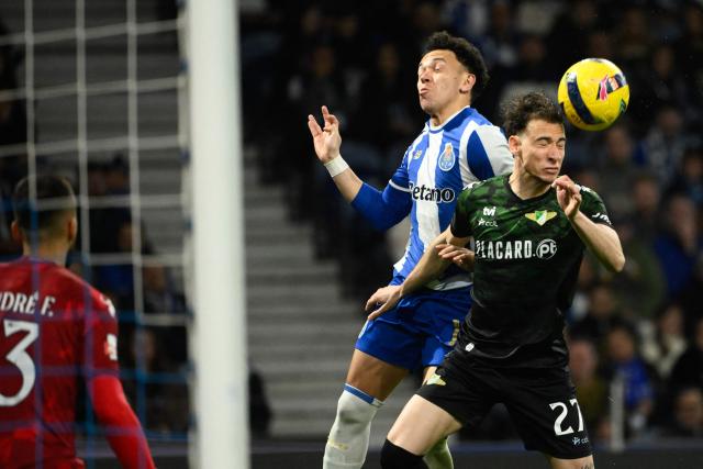 Moreirense's Portuguese defender #27 Francisco Domingues (R) heads the ball as FC Porto's Brazilian forward #11 Pepe tries to score during the Portuguese League football match between FC Porto v Moreirense at Dragao stadium in Porto, on March 15, 2026. (Photo by Miguel RIOPA / AFP)