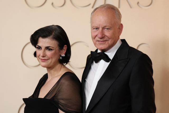 Swedish actor Stellan Skarsgard and his wife producer Megan Everett-Skarsgard attend the 98th Annual Academy Awards at the Dolby Theatre in Hollywood, California on March 15, 2026. (Photo by ANGELA WEISS / AFP)