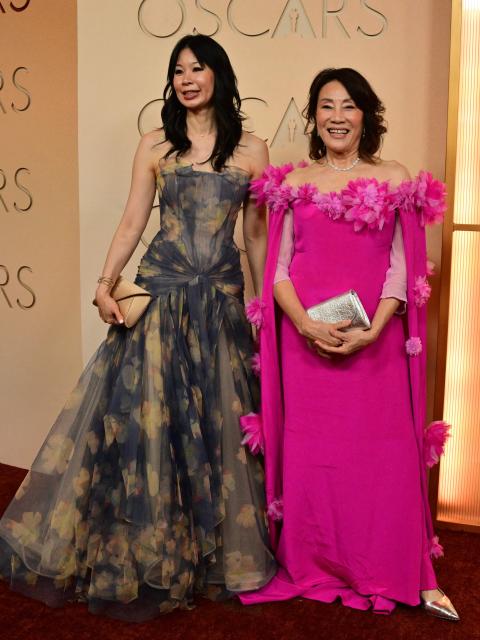 President of the Academy of Motion Picture Arts and Sciences Janet Yang (R) and writer-director Georgia Lee attend the 98th Annual Academy Awards at the Dolby Theatre in Hollywood, California on March 15, 2026. (Photo by Frederic J. Brown / AFP)