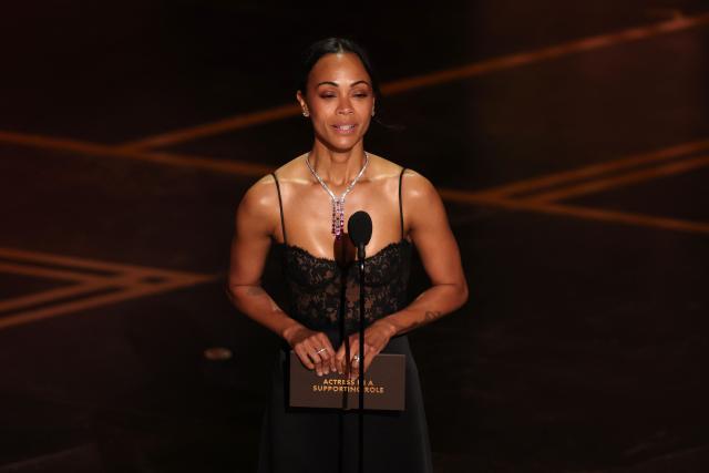 US actress Zoe Saldana presents the Best Actress in a Supporting Role award onstage during the 98th Annual Academy Awards at the Dolby Theatre in Hollywood, California on March 15, 2026. (Photo by Patrick T. Fallon / AFP)