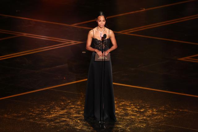 US actress Zoe Saldana presents the Best Actress in a Supporting Role award onstage during the 98th Annual Academy Awards at the Dolby Theatre in Hollywood, California on March 15, 2026. (Photo by Patrick T. Fallon / AFP)