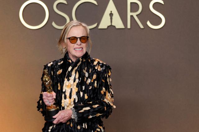 US actress Amy Madigan poses in the press room with the Oscar for Best Actress in a Supporting Role for "Weapons" during the 98th Annual Academy Awards at the Dolby Theatre in Hollywood, California on March 15, 2026. (Photo by VALERIE MACON / AFP)