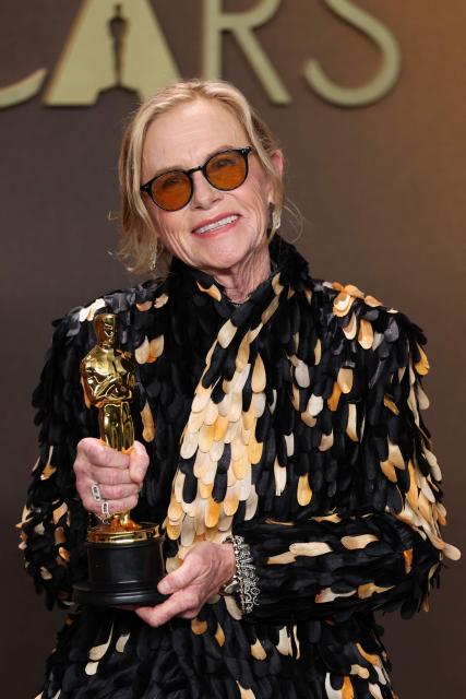 US actress Amy Madigan poses in the press room with the Oscar for Best Actress in a Supporting Role for "Weapons" during the 98th Annual Academy Awards at the Dolby Theatre in Hollywood, California on March 15, 2026. (Photo by VALERIE MACON / AFP)
