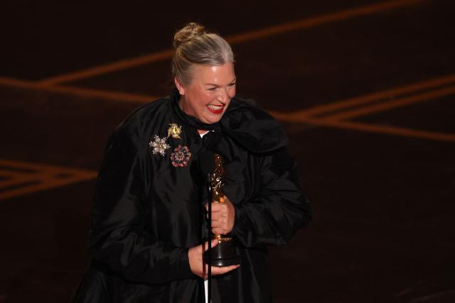 US costume designer Kate Hawley holds her Oscar for Best Costume Design for "Frankenstein" onstage during the 98th Annual Academy Awards at the Dolby Theatre in Hollywood, California on March 15, 2026. (Photo by Patrick T. Fallon / AFP)