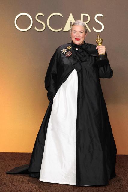 US costume designer Kate Hawley poses in the press room with her Oscar for Best Costume Design for "Frankenstein" during the 98th Annual Academy Awards at the Dolby Theatre in Hollywood, California on March 15, 2026. (Photo by VALERIE MACON / AFP)
